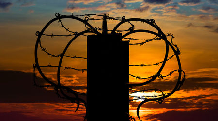 Walls cannot be topped by razor wire or similar material